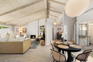 Dining area next to back patio with BBQ.