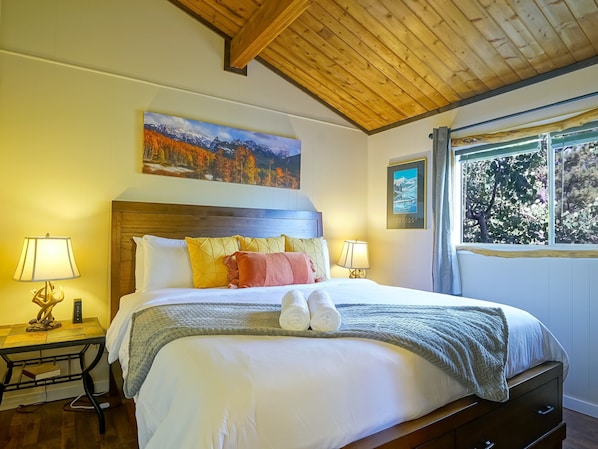 Drift off to sleep in a luxurious king bed with crisp, clean white linens. Each bedroom is equipped with its own Smart TV, offering ultimate comfort and convenience for your stay.