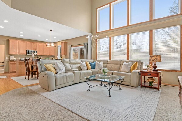 Minne-Getaway: Timber Ridge features a majestic 2 story great room with a view of the private backyard.
