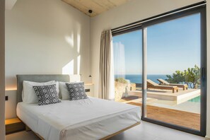 The second bedroom features a Queen size bed and an en-suite bathroom with a stand-up shower