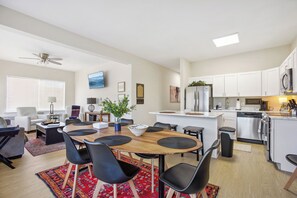 Kitchen and dining room in one photo.
