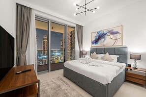 Master Bedroom: Revel in stunning skyline views from this chic retreat with modern decor and soft lighting!