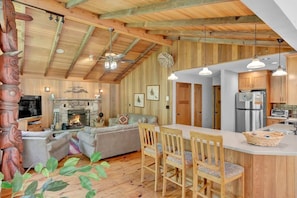The kitchen features a convenient breakfast bar for grabbing a quick bite or for keeping the chef in your group company as they create fabulous meals in the kitchen. The open concept lets the chef stay part of the conversation or watch the game. 