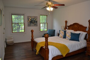 Bedroom 1 - natural light with a sitting area, desk and spacious walk-in closet
