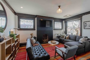 Relax and unwind in style within the spacious club style living room including a futon for extra sleep space.