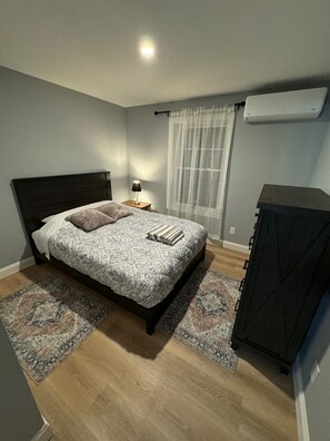 Bedroom 2 located on 2nd floor has large closet, night stand with chargers. 