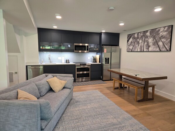 Full kitchen with high-end appliances and custom German cabinets.  