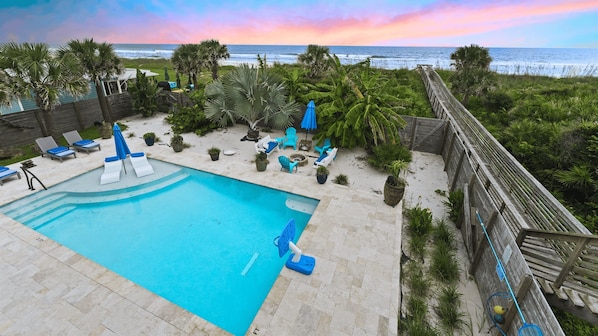 Don't miss out on direct beachfront access! This home is right on the ocean, with a pool, firepit, private boardwalk down to the sand + more!