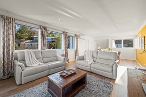 Comfortable living area with electrically reclining sofas