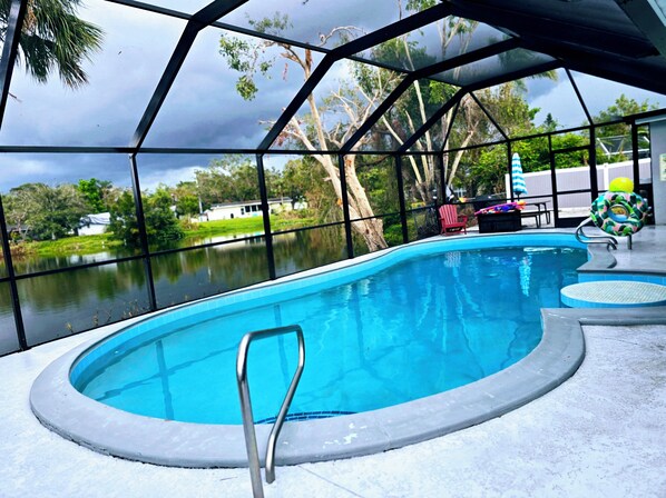 Upgraded heated pool view,  just next to the beautiful lake 