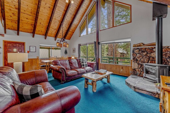 Living Room: 2 couches, gas fireplace, 40” TV, patio access