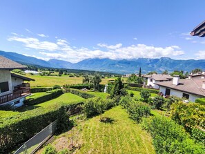 Sky, Cloud, Plant, Mountain, Green, Natural Landscape, Building, Land Lot, Vegetation, Highland
