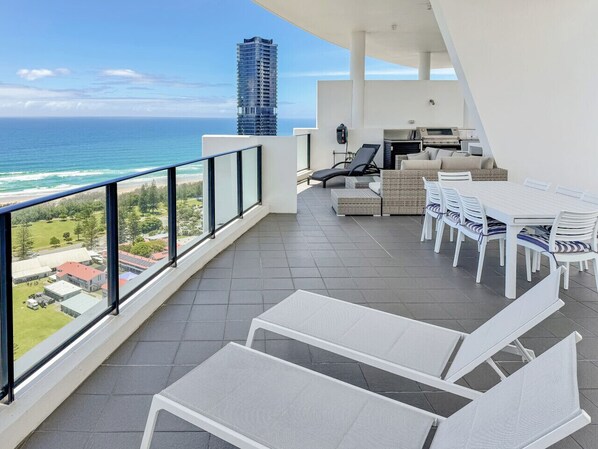 Massive private roof terrace with BBQ 2 x lounge areas and dining table.