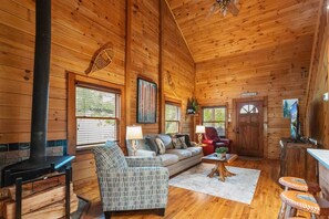 Main Floor Living Room has Wood Floors and Floor to Ceiling Tongue and Groove