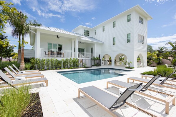 Resort style private, heated pool with sun loungers 
