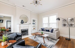 Second floor living room converts to 4th bedroom with queen sofa bed