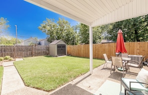 Large backyard with covered patio