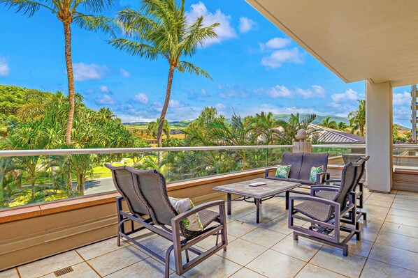 Unwind on the spacious lanai at Honua Kai Konea 232 with cozy seating and scenic island views.