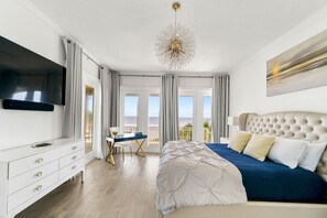 Primary Suite Dream: Indulge in the soothing sounds of the waves right from the comfort of your bed