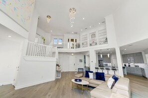 Living Room Elegance: Revel in the Beauty of High Ceilings and an Open Concept Design for Effortless Living