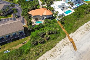 Beachfront Paradise Awaits: Experience the Ultimate Coastal Retreat with the Beach Just a Step Away