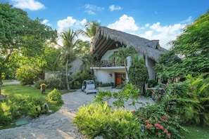 Caleton Villa 6: view of the front of the property and golf cart parking