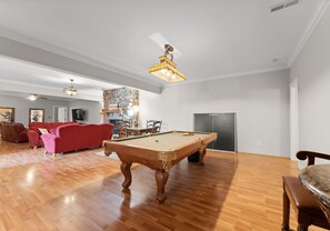 Lower level rec area - pool table with ping pong topper.