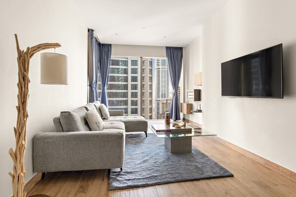 Living Room: Enjoy spectacular city views while lounging on stylish, modern furniture!
