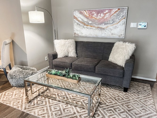 Spend a night in and unwind on the comfortable couch watching your favorite shows on the TV