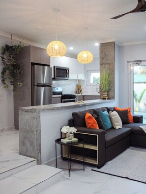 A splash of color and comfort: the living room at EVA Resort, where every detail is designed for relaxation and style.