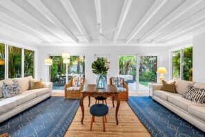 Comfortable space with 2 sofas (one is a queen sleeper), smart TV with cable, books, magazines, and games. Direct access to the outdoor patio and pool. Features an active door alarm to the pool deck for added safety.