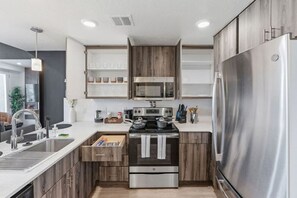 Keep your meals fresh and delicious with our spacious refrigerator, complete with a full set of kitchen essentials.