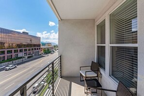 Sip your morning coffee on the veranda with a stunning view and cozy seating.