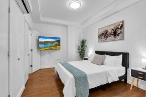 Relax and unwind in the cozy bedroom, complete with a flat-screen TV for your entertainment.