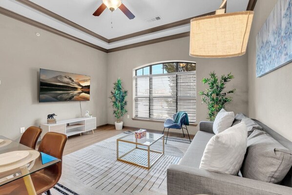 Relax in style on our cozy couch while enjoying your favorite shows on the flat-screen TV!