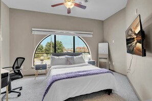 Relax in the bedroom with a plush bed, enjoy your favorite shows on the TV, or get work done at the dedicated desk.