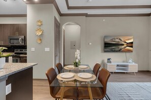 Experience seamless living with our open-concept space combining the kitchen, dining, and living areas.