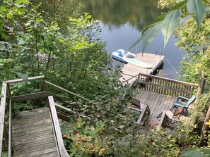 View of lower deck with seating and dock from above