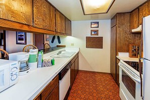 Kitchen w/ toaster, drip coffee pot, slow cooker, blender and more
