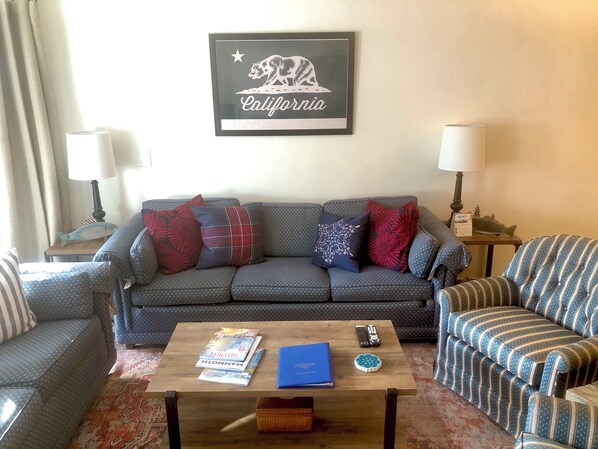 Living room w/ sofa sleeper, wood burning fireplace, 42" TV, DVD player