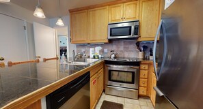Kitchen with drip coffee maker, Keurig, toaster, slow cooker, blender, and more