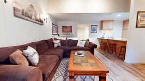 Living room w/ TV, DVD player, wood burning fireplace