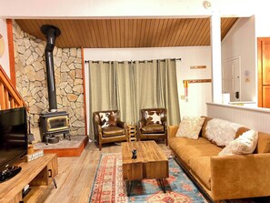 Living room with Apple TV, DVD player, fireplace