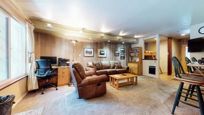 Living room w/ wood burning fireplace, TV, DVD player, sofa sleeper