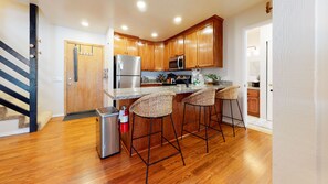 Kitchen with drip coffee pot, slow cooker, blender, toaster, and more