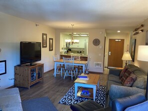 Newly updated living room with fireplace and TV