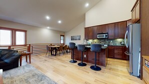Kitchen with drip coffee maker, blender, dishwasher, gas stovetop and more