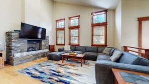 Living room with flat screen TV, gas fireplace and comfortable seating
