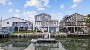 5 Bedrooms with multiple balconies, dock, and only 2 blocks from the beach.