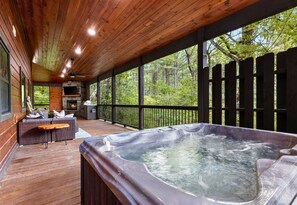 Unwind in the hot tub on the screened-in porch, where you can relax and enjoy the fresh air no matter the weather.